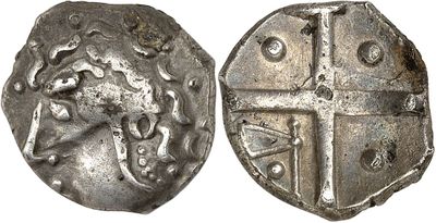 a silver coin with a cross on the front and a shield on the back