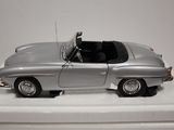 a toy car that is sitting on a white surface