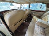 a view of the inside of a car from the driver ' s seat