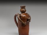 une image représentant un vase marron et un homme tenant un poisson