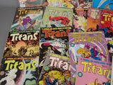 a lot of comic books that are on the table