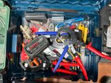 a blue tool box filled with assorted electrical tools