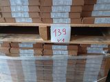 a stack of boxes on a pallet with a price tag