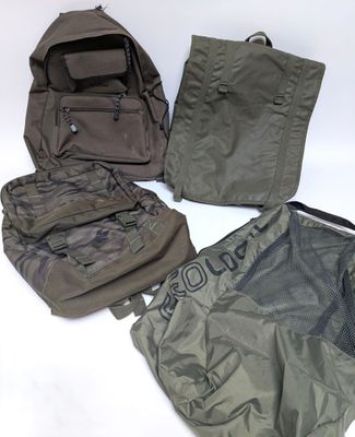 four pieces of luggage sitting on a white surface