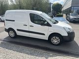 a white van that is parked in a parking lot