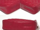 a picture of a pair of red leather handbags