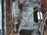a drill in a case with a cord in it