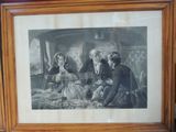 a framed picture of a group of people sitting on a couch