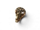 a close up of a gold ring with a bird ' s head on it