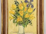 yellow and blue flowers in a vase on a yellow background