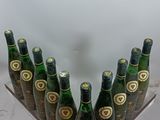bottles of beer are lined up in a row on a table