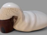 an image of a cup of ice cream with a worm on it