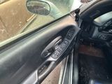a picture of a car door handle and a steering wheel