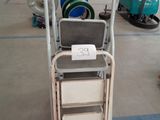 a cart that has a sign on it in a warehouse