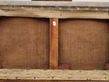 an old suitcase with a wooden handle is sitting on a white surface