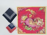 two pieces of cloth on a white surface