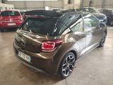 a brown car that is parked in a garage