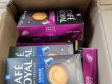 several boxes of coffee are stacked on top of each other
