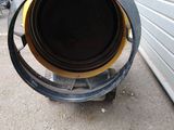 a large metal pipe that is outside of a building