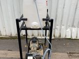 a white container sitting on a cart with a hose attached to it