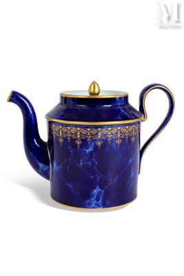 blue and gold teapot on white background with white background
