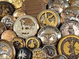 a lot of different types of buttons on a table
