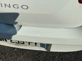 a close up of the rear end of a white car