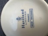 a white bowl with a blue and white design on it