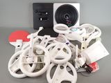 a pile of assorted electronics sitting on a table