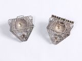 pair of silver earrings with pearls and diamonds on a white background