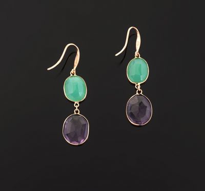 a pair of gold earrings with green and purple stones