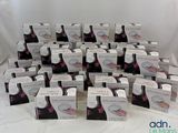 several boxes of cupcakes sitting on a table with a white background