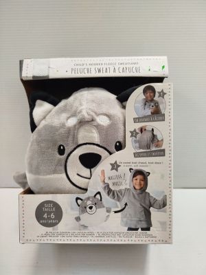 the box is open to show the contents of a stuffed animal