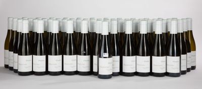 several bottles of wine are lined up in a row