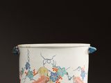 a white cup with a floral design on it