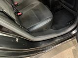 a black car with a black leather seat and a black dashboard