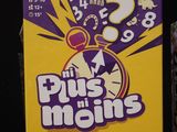 purple and yellow box with question marks on it sitting on top of a table