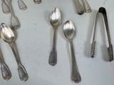 a lot of silver spoons and spoon spoons on the table
