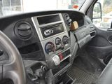 a dashboard of a truck with a lot of buttons