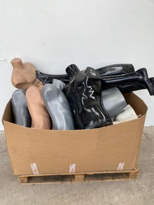 a cardboard box filled with assorted items on the floor
