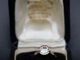 a ring that is sitting in a box on a table