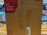 packaging of a cream maker sitting on a wooden table in a store