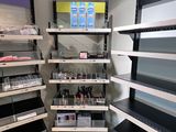 many shelves with cosmetics products on them in a store