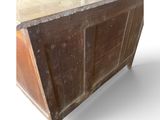 a wooden cabinet with a marble top on a white background