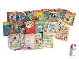 a lot of comics on display on the table