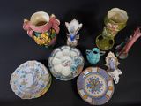 many different types of vases and plates on the table