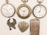 many different types of pocket watches on display