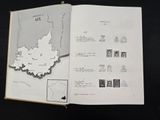 an open book with a map on it on a table