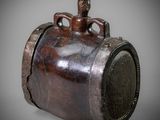 an old wooden barrel with a handle on a gray background