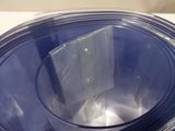 a stack of blue plastic plates on a white table